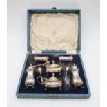 A cased six piece silver cruet set, by Walker & Hall, Sheffield 1955, with shaped edges, on pad
