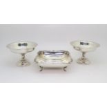 A silver rectangular dish, by Barker Brothers Ltd, Birmingham, and a pair of weighted silver