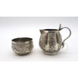 An Indian Kutch silver cream jug, with a cobra handle, and an Indian silver sugar bowl, 157gms (2)
