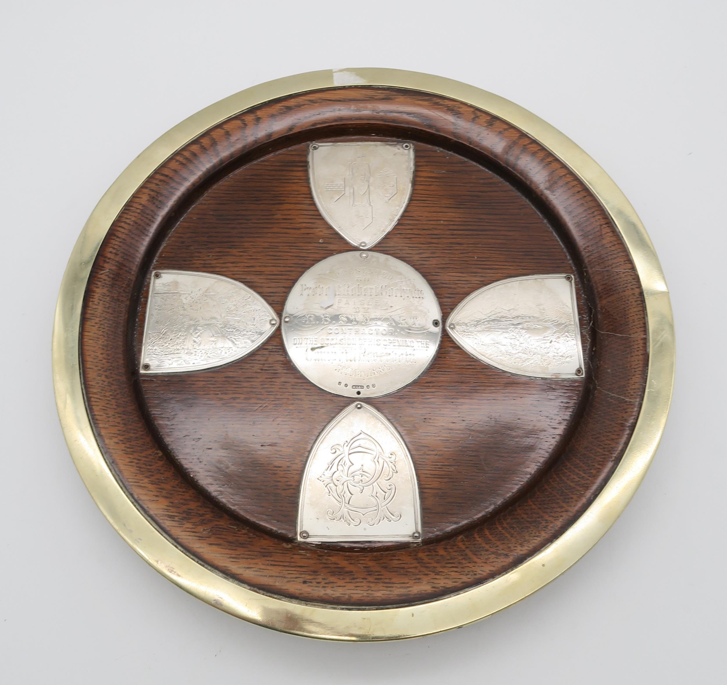 A silver mounted wooden salver, Glasgow 1885, the central roundel engraved 'Presented to Provost
