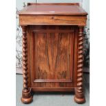 A Victorian rosewood Davenport writing desk with sliding hinged writing slope top concealing