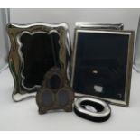 A collection of silver and EPNS photo frames including a triple picture oval example, by Carrs of