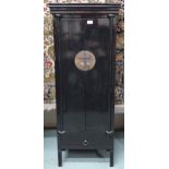 A 20th century Oriental black lacquer narrow cabinet with pair of cabinet doors with metallic mounts