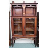 A late Victorian mahogany and satinwood Arts & Crafts bookcase with open shelved superstructure over