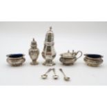 A late Victorian four piece silver cruet set, Birmingham marks, 1899 / 1900, decorated with ribbon