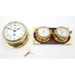 A brass ship's bulkhead clock by Kelvin, Bottomley & Baird, Glasgow, the white enamelled dial with