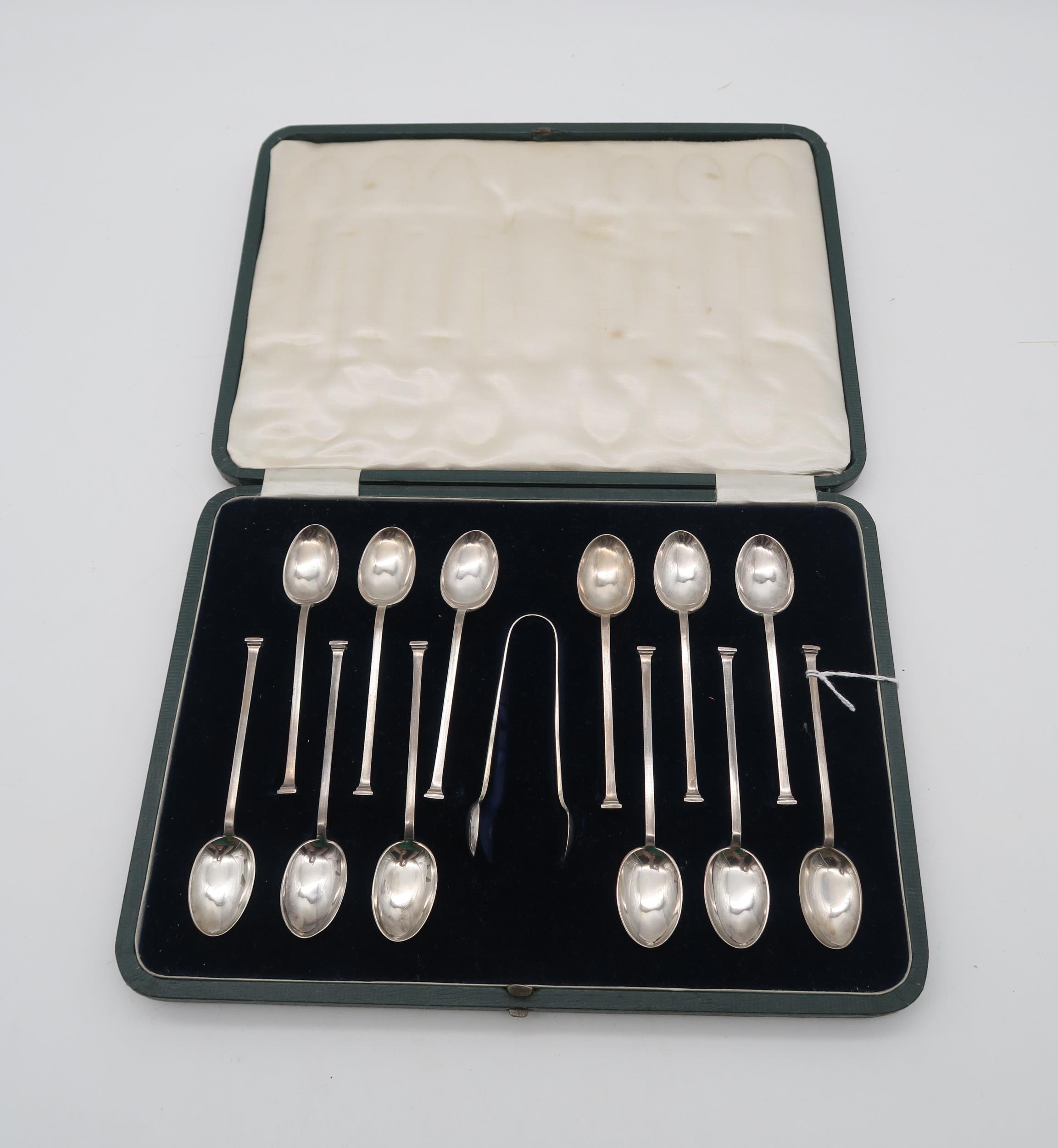 A cased set of silver seal top tea spoons and sugar tongs, by Cooper Brothers & Sons, Sheffield