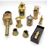 A collection of industrial brass/metal ware, to include a small spouted jug with applied brass label