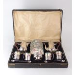 A CASED GEORGE V SILVER MOUNTED PARAGON COFFEE SERVICE the coffee cans and saucers floral and gilt