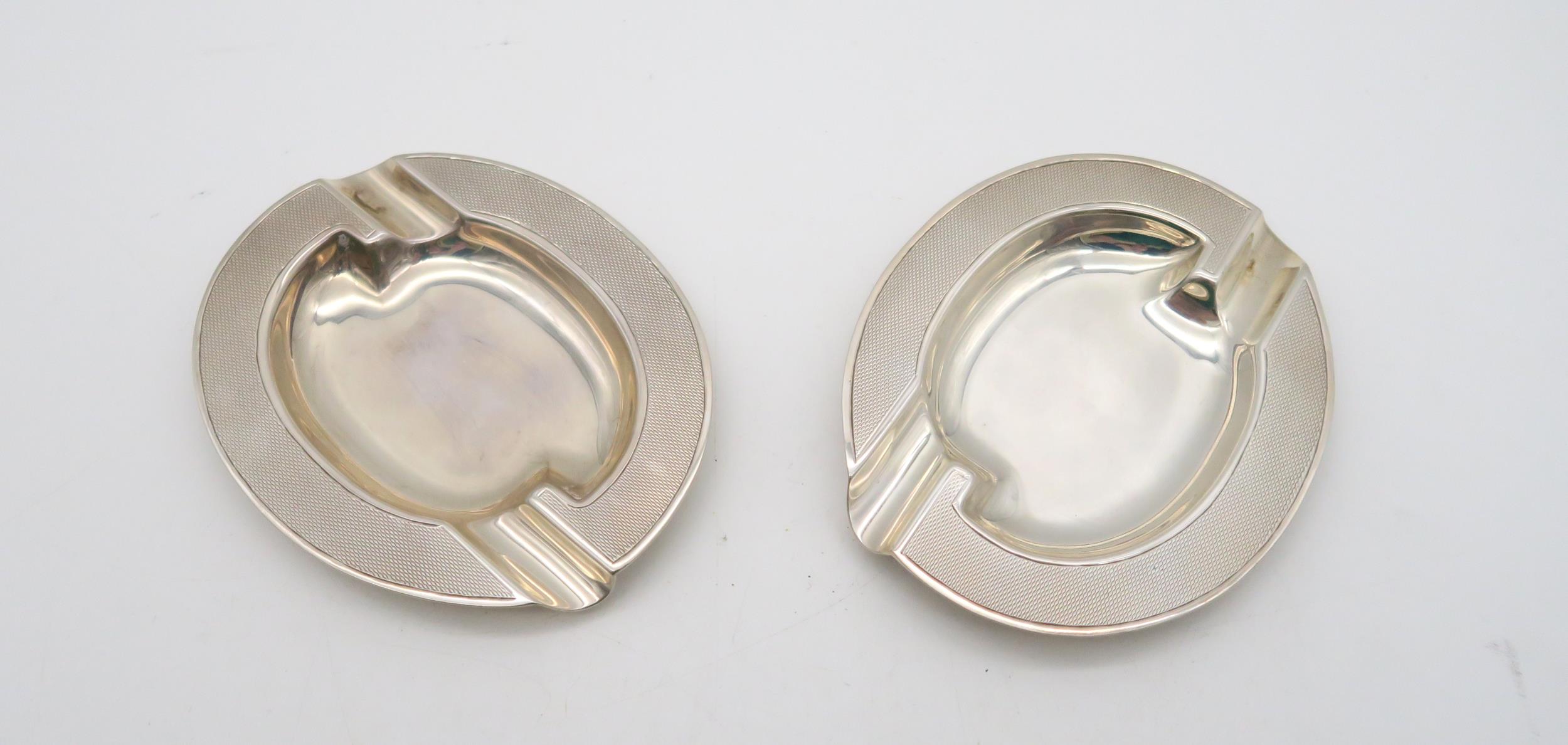 A pair of Art Deco style silver ash trays, by Henry Clifford Davis, Birmingham 1959, 132gms (2)