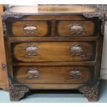 A 20th century Oriental hardwood two over two chest of drawers with carved corners and feet, 90cm