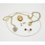 A 9ct white gold cable style necklet, together with a 9ct bracelet, a clear gem set heart pendant on
