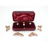 Two pairs of 9ct gold cufflinks, weight 5gms together with a boxed set of yellow metal shirt studs