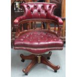 A 20th century button back leather upholstered captain style swivel desk chair, 89cm high x 62cm