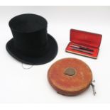A silk top hat, small size, by McLaren & Son, Gentlemen's Hatters, Glasgow, measuring approx. 19.4cm