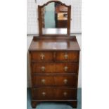 A 19th century mahogany dressing chest with dressing mirror mounted on two over three chest on