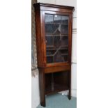 A late Victorian astragal glazed corner cabinet (cracks to glass door), 177cm high x 74cm wide