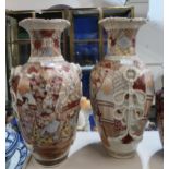 A pair of Kutani style stoneware vases, decorated with a Daimyo surrounded by attendants, with