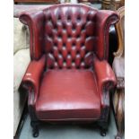 A 20th century Chesterfield style leather button back upholstered armchair on cabriole supports,