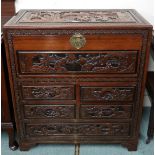 A 20th century Chinese camphorwood chest with hinged top over four short over one long drawer all