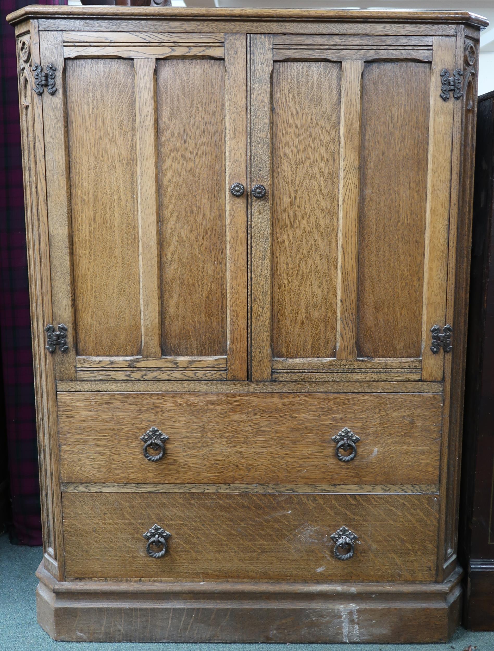 A 20th century AY Crown Furniture oak gents tall boy with pair of panel doors over two long