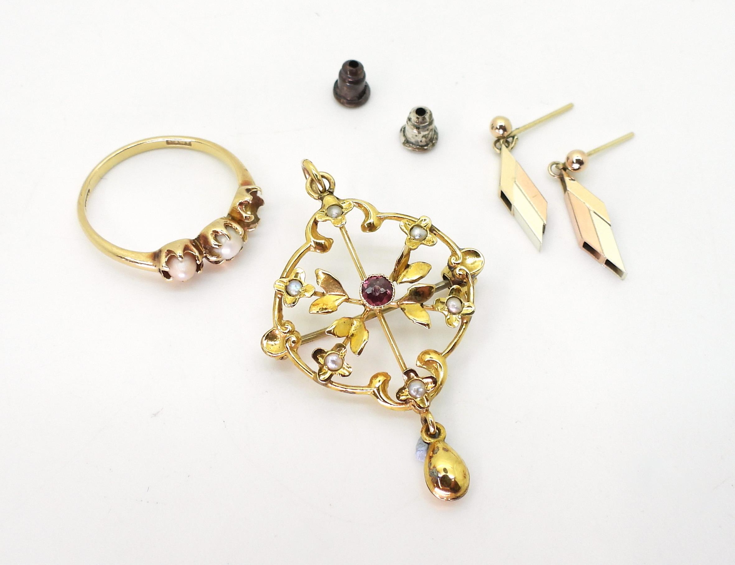 A 9ct gold Edwardian pendant brooch set with seed pearls and a pink gem, length 4.2cm, and a pair of