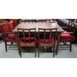 A mid 20th century teak extending dining table and six chairs, table is 77cm high x 128cm long (