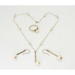 A 9ct gold fine chain, strung with pearls, with a pair of similar earrings and a ring, size M1/2