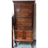 A 20th century mahogany tall chest with dentil corniced top over six drawers over pair of cabinet