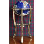 A 20th century brass framed stone inlaid freestanding globe Condition Report:Available upon request