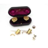 A pair of boxed shirt studs (probably B&F) together with two 'Tigers Claw mounts (removed) in bright