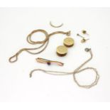 A collection of gold and yellow metal items, to include a 9ct  brooch set with a pink gem, a 9ct
