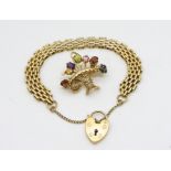 A 9ct gold fancy link bracelet with a heart shaped clasp and a 9ct gold multi colour gemstone and