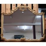 A 20th century gilt framed Rococo style overmantle wall mirror, 114cm high x 135cm wide and a pair