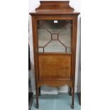 An Edwardian mahogany astragal glazed music cabinet on square supports, 143cm high x 56cm wide x
