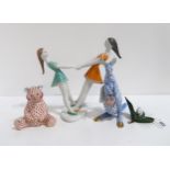 Three Herend figures including a blue and red Kangaroo and roo, a red bear and a rabbit sat on a