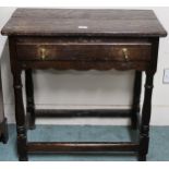 A 18th/19th century oak single drawer side table on turned supports joined by stretchers, 71cm