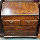 A 19th century oak and walnut veneered writing bureau with fitted fall front writing compartment