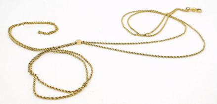 A yellow metal guard chain with slider, length 136cm, weight 10.8gms Condition Report:Available upon