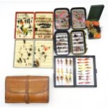 Fishing flies, in cases, to include an attractive early-20th century tooled tan leather book-form