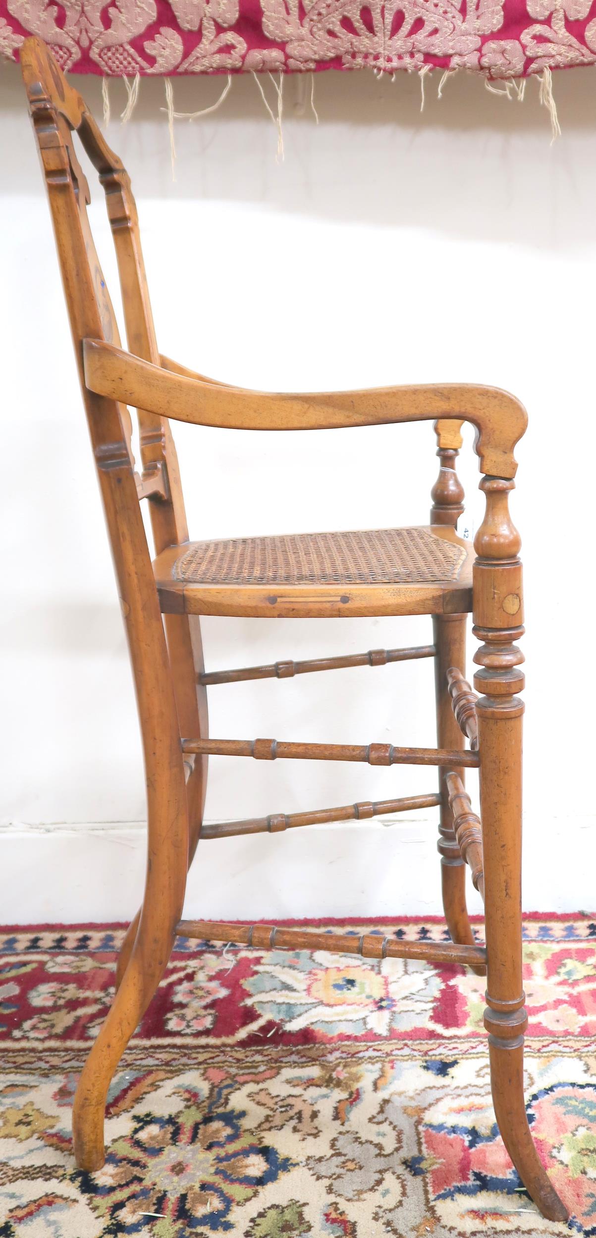 A Victorian walnut framed bergere children's high chair with shaped splat inlaid with game bird over - Image 3 of 3
