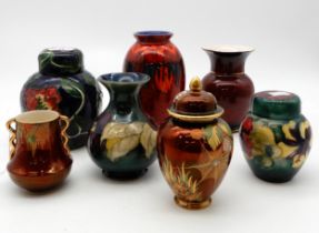 A Moorcroft clematis vase and Hibiscus ginger jar, a Poole pottery vase, Carlton Ware etc