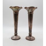 A pair of silver trumpet vases, by Walker & Hall, Sheffield 1941, bases loaded, 27.5cm (2) Condition