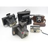 An Agfa Isolette camera with leather case, Kodak Instamatic camera, Admiral binoculars and two