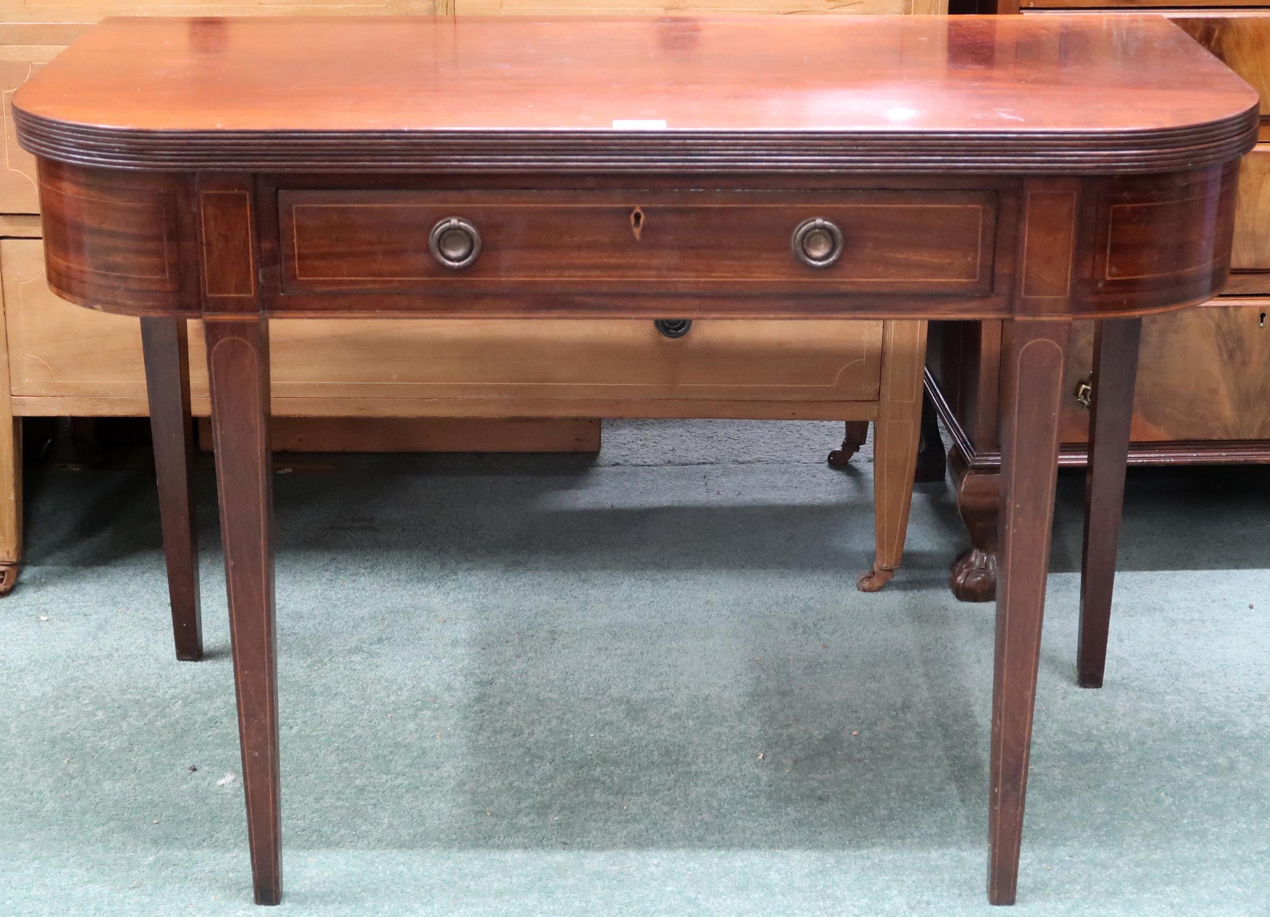 A Victorian mahogany fold over tea table with single drawer on square tapering supports, 67cm high x