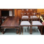 A lot comprising 20th century mango wood coffee table and four sabre legged dining chairs (5)