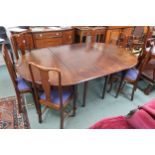 A Georgian mahogany D end dining table with two D end tables joined by central table with two