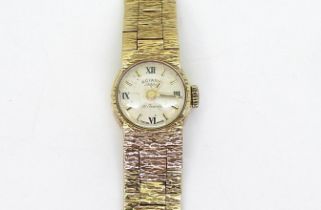 A 9ct gold retro ladies Rotary watch, diameter of the case 15mm, length of bark textured strap16.