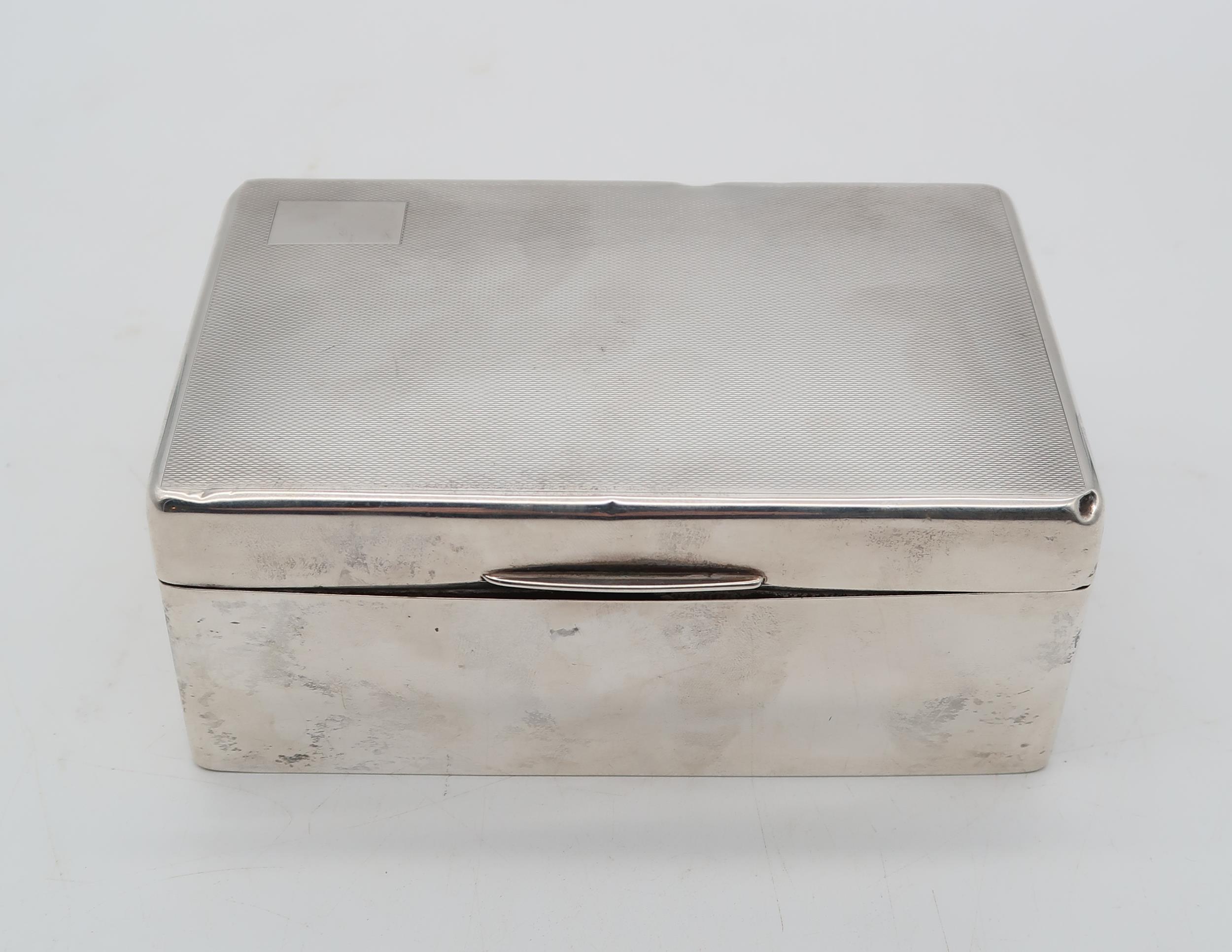 A George V silver cigarette box, by William Neale Ltd, Birmingham 1936, of rectangular form, the