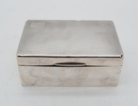 A George V silver cigarette box, by William Neale Ltd, Birmingham 1936, of rectangular form, the